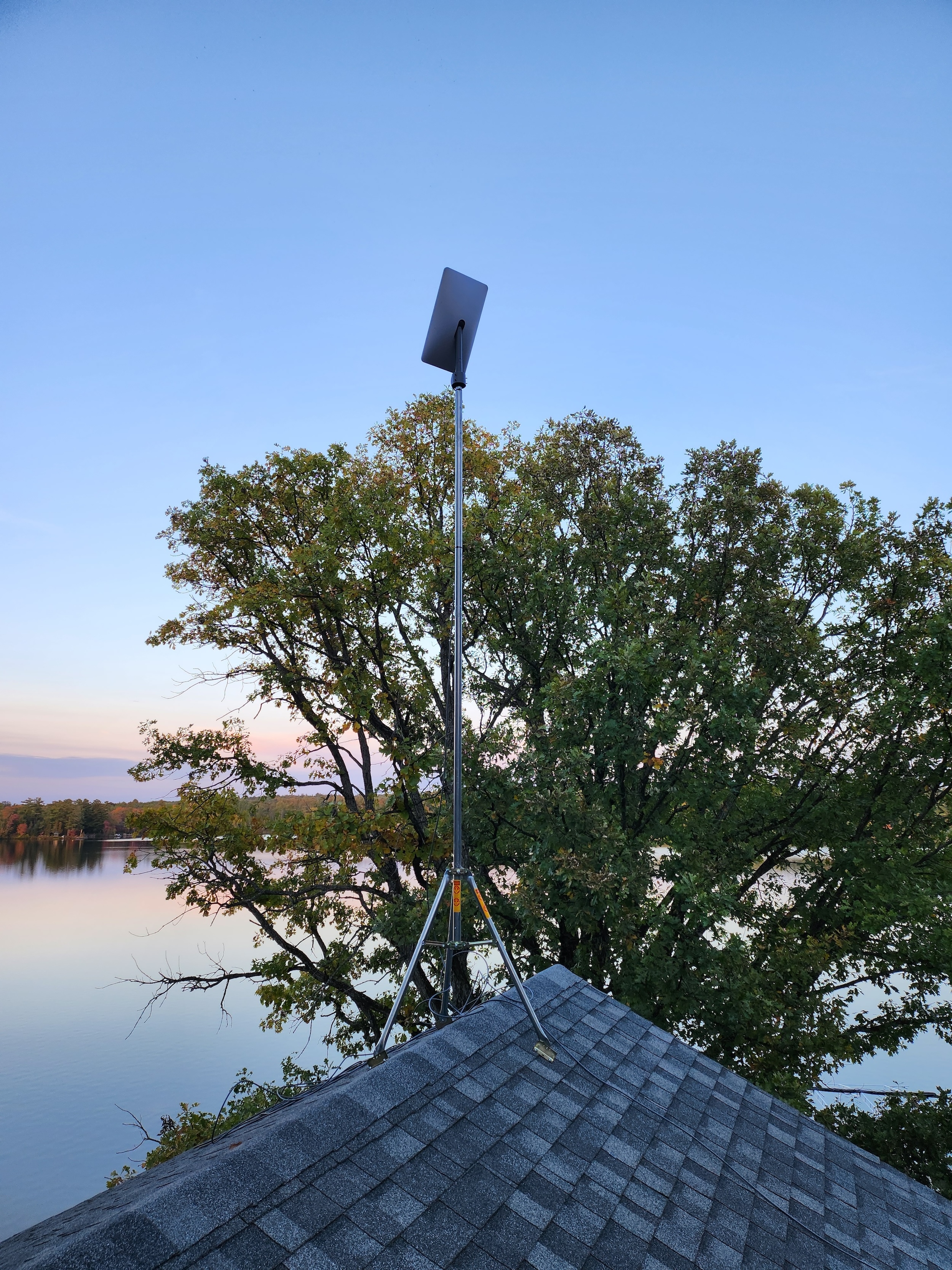 rooftop starlink antenna and a view of open sky