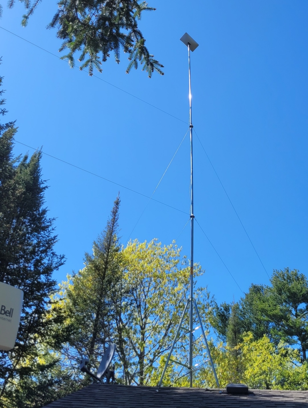 60 foot starlink tower in clear blue sky